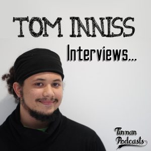 The podcast cover for Tom Inniss Interviews. The image shows Tom Inniss in a black shirt with black headband, with the text 'Tom Inniss Interviews' at the top, and the Tinman Podcasts branding to the right.